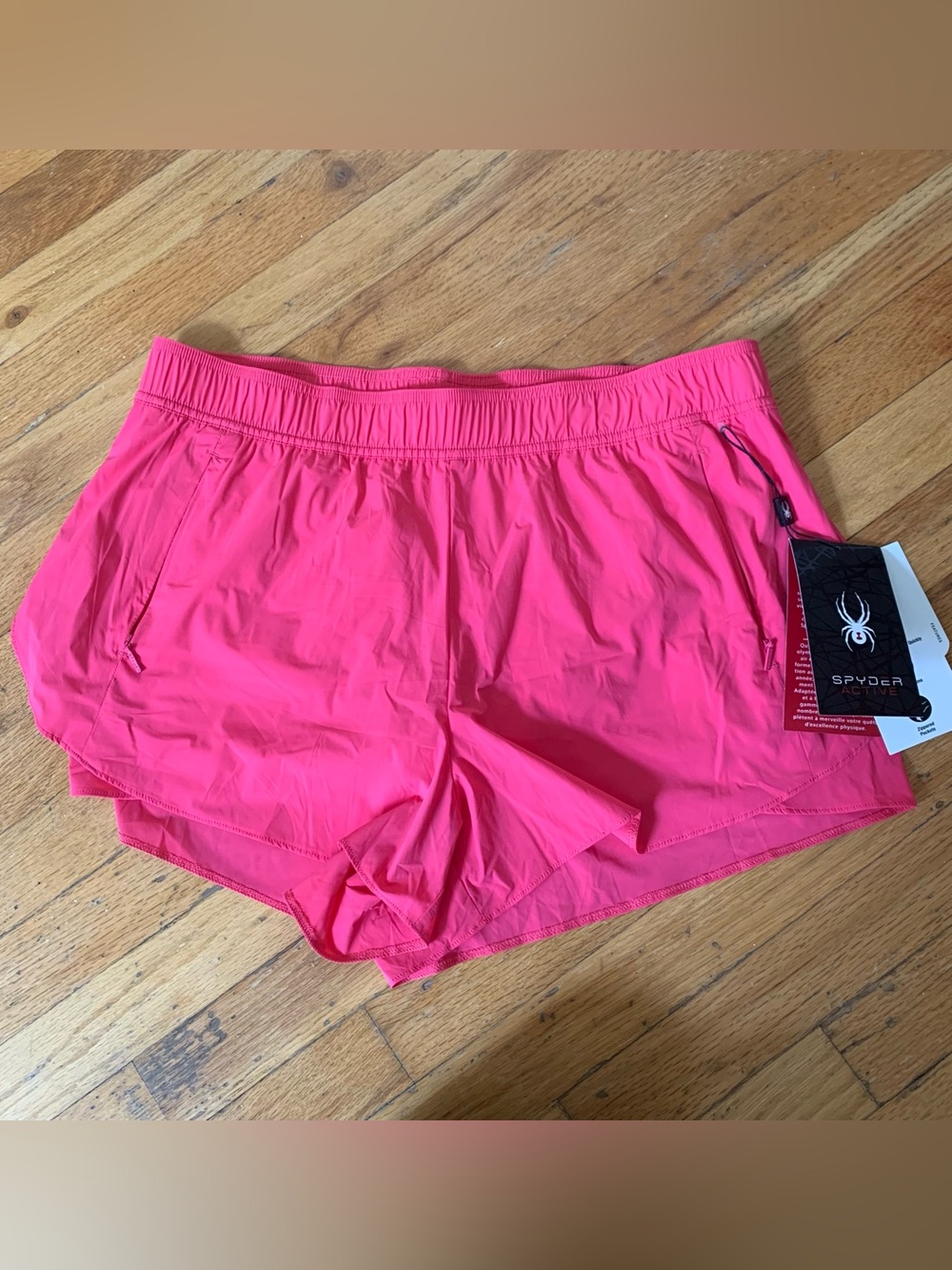 Spyder pink running shorts with pockets size L